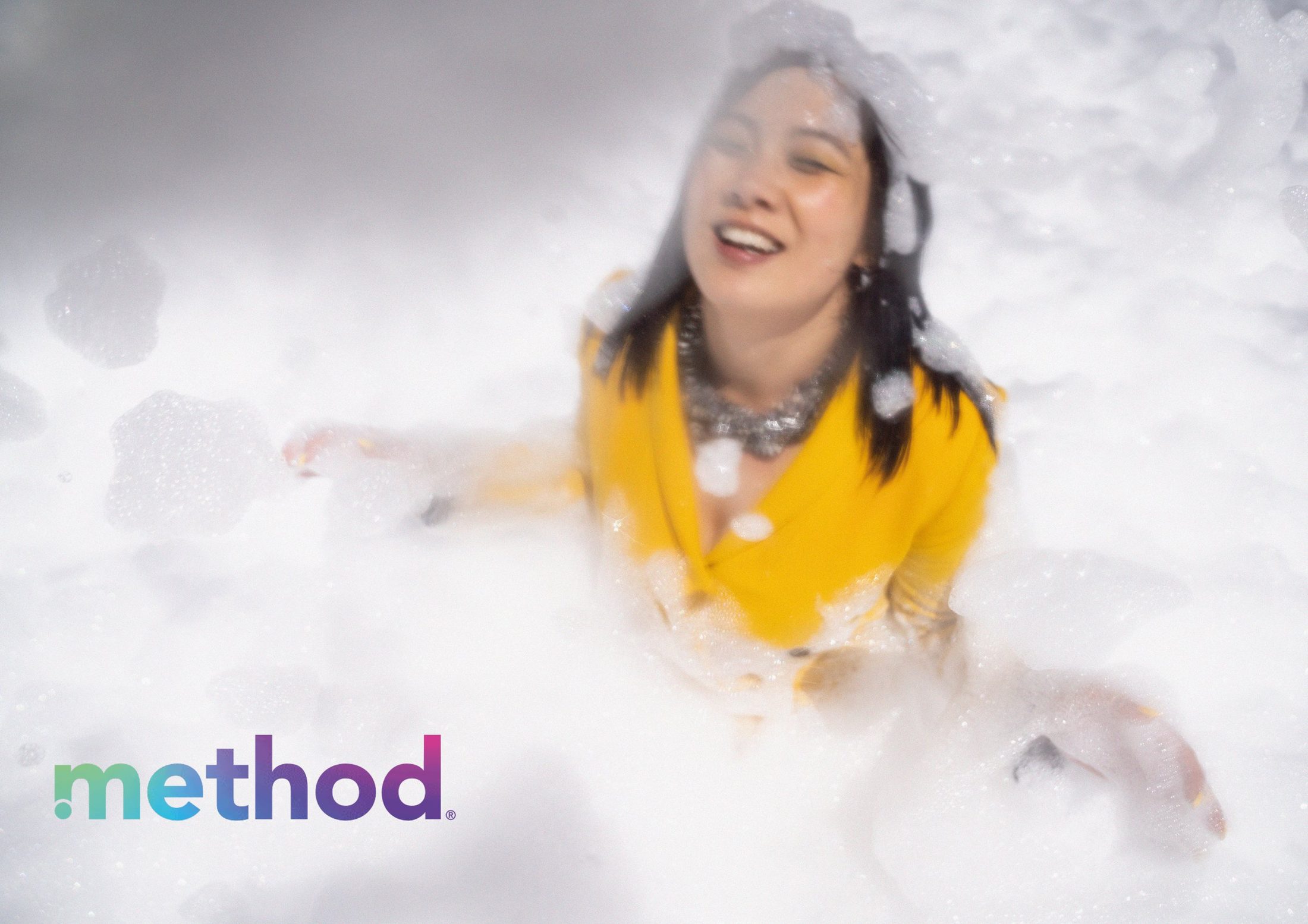 A woman falling back into foam, method