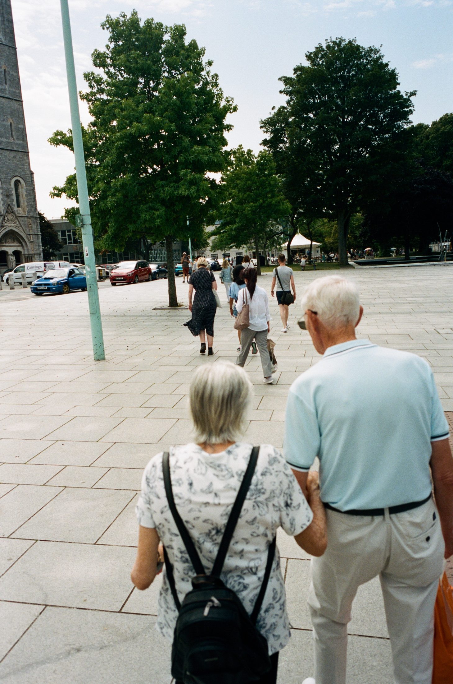 Elderly couple walking hand in hand