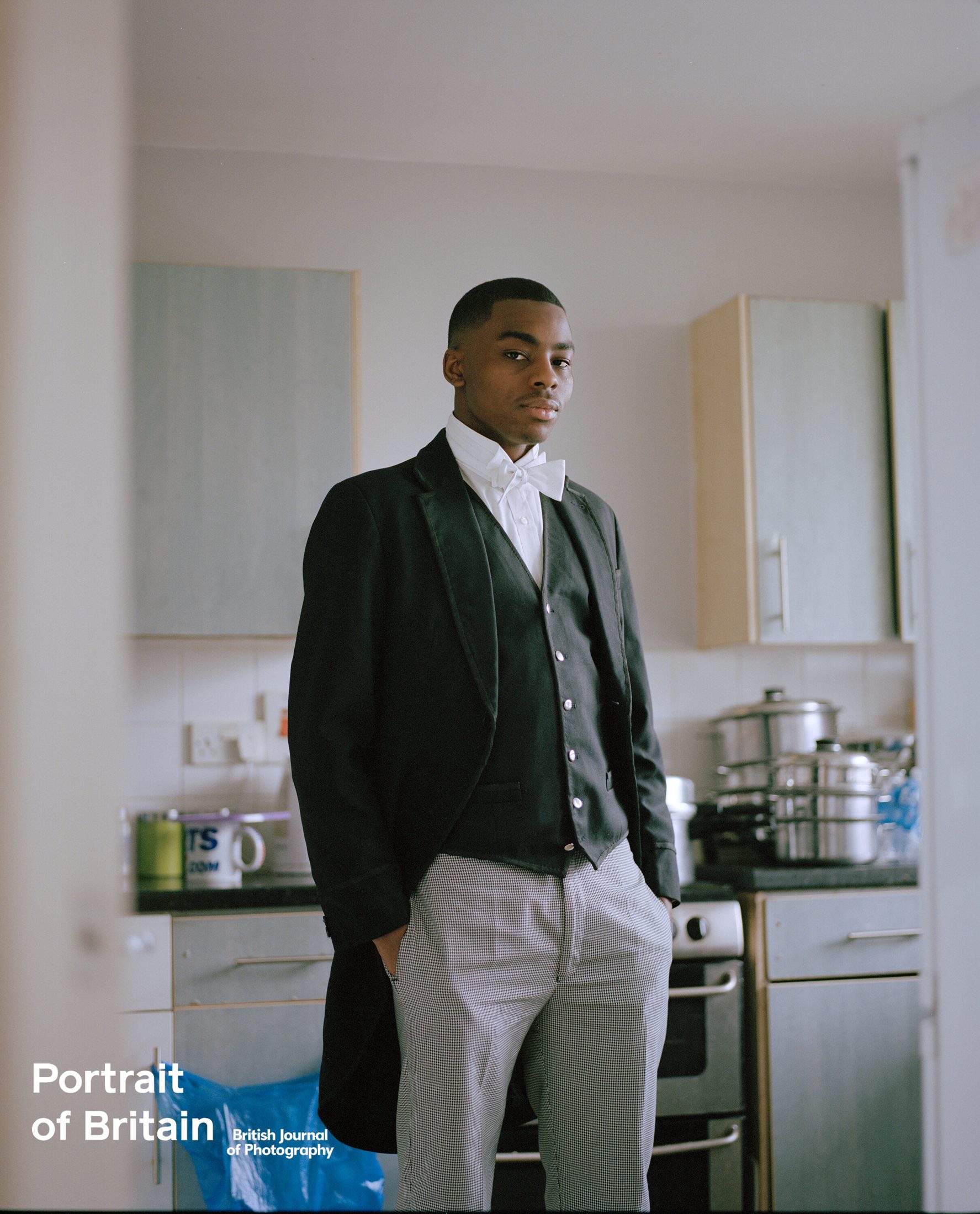 Joshua standing in his kitchen — Portrait of Britain